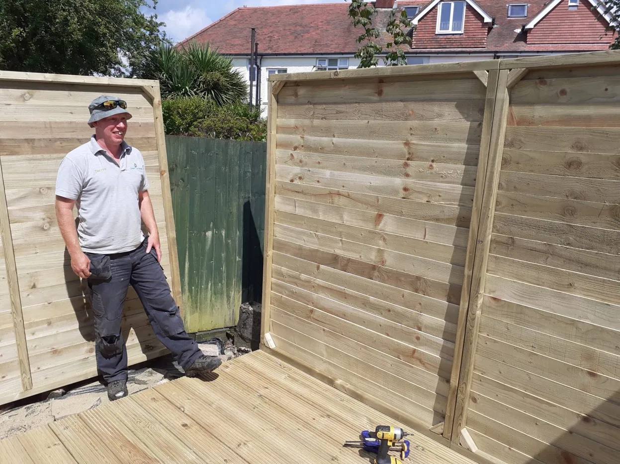 Darren Clare on site with a new fence and deck