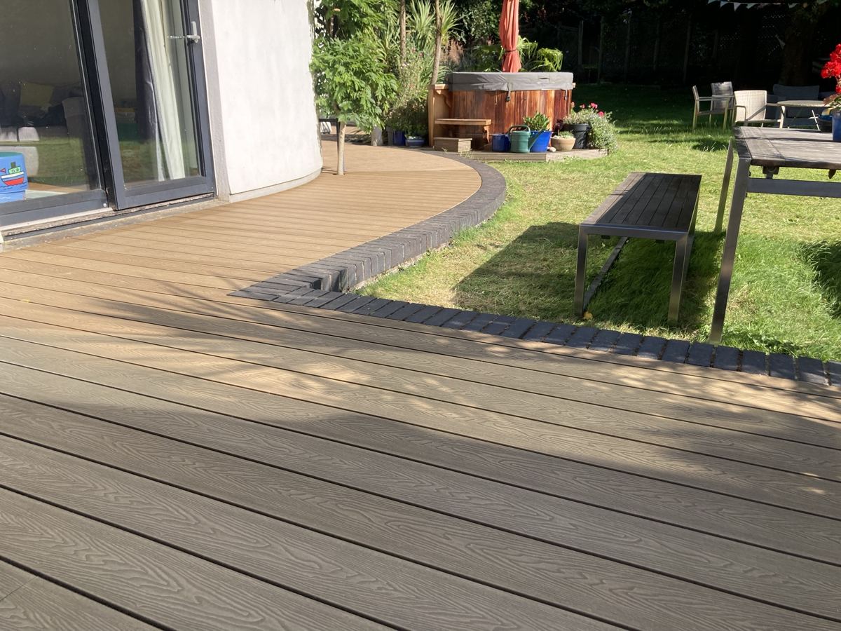 Composite deck running along the house