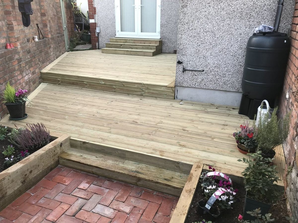 Two-tier timber deck with sleeper raised beds